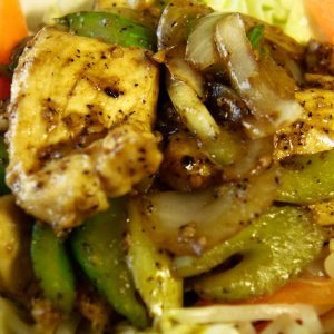 celery, and onion in a garlic brown sauce with ground black pepper