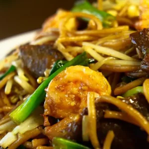lo mein dishes made with soft noodles, cabbage, onion, scallion & bean sprouts