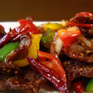 breaded beef with onion, bell peppers, pineapple, carrots in house special sauce