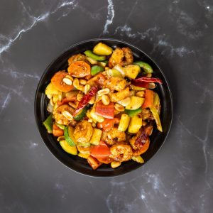 zucchini, bell peppers, onion, carrot, celery in spicy sauce topped with peanuts