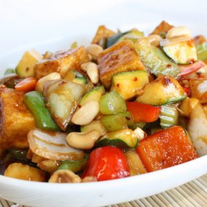 zucchini, bell peppers, onions, carrots, celery in spicy sauce topped with peanuts