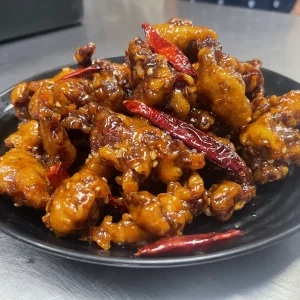 Breaded beef in house made orange sauce