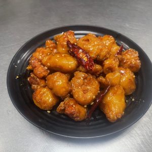 Breaded chicken with house made orange sauce