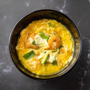 12 pcs of shrimps sautéed with eggs, peas & carrot, & snow peas