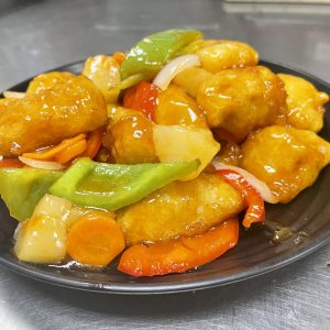 fried soy chicken with pineapple, onions, bell peppers, carrots, celery